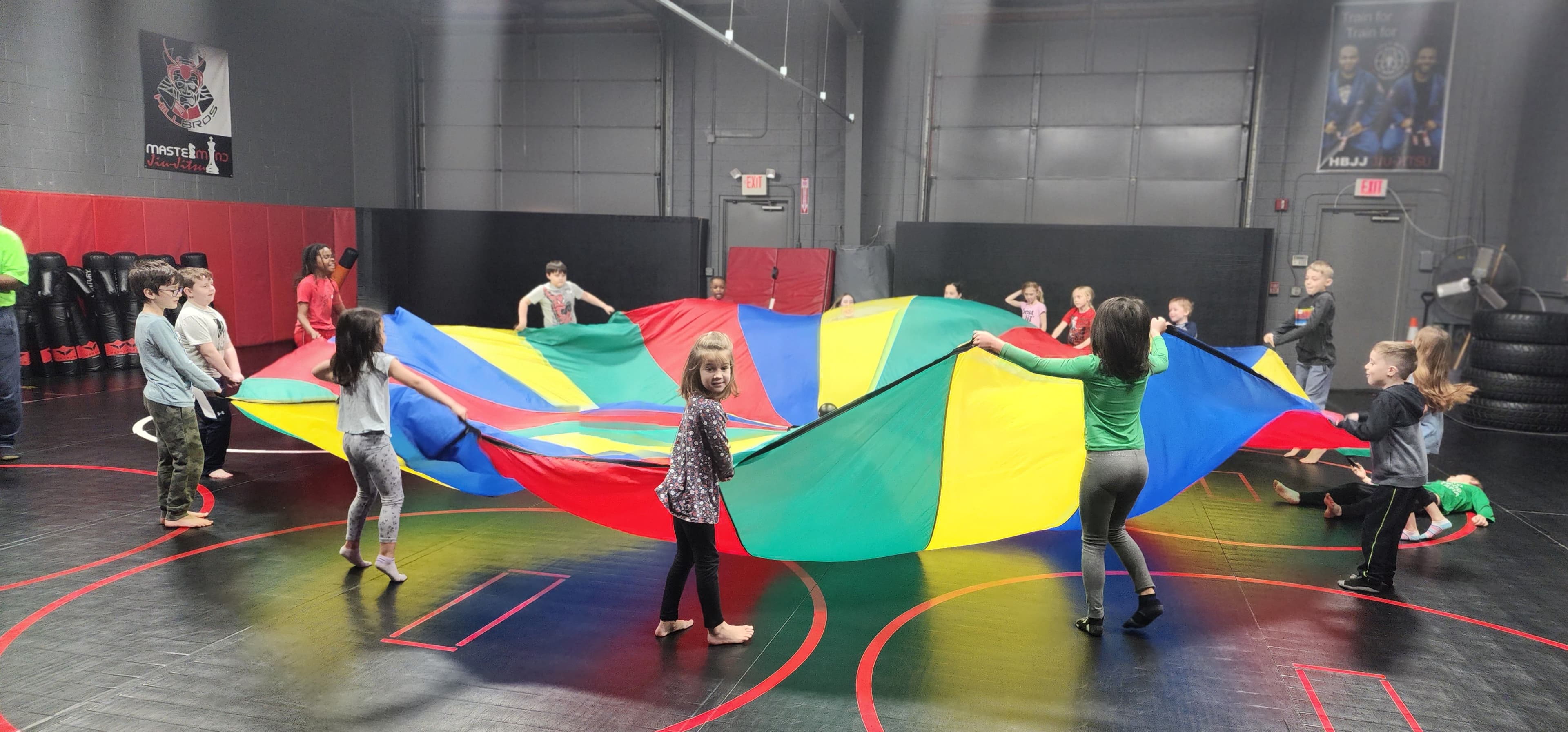 Children taking part in a group parachute activity