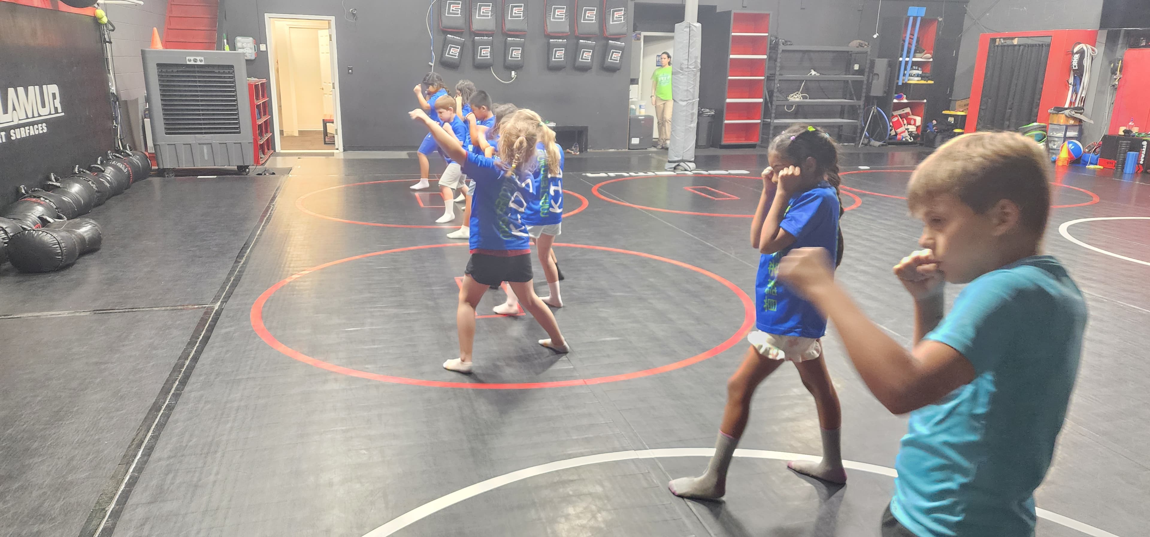 Children practicing a self-protection technique