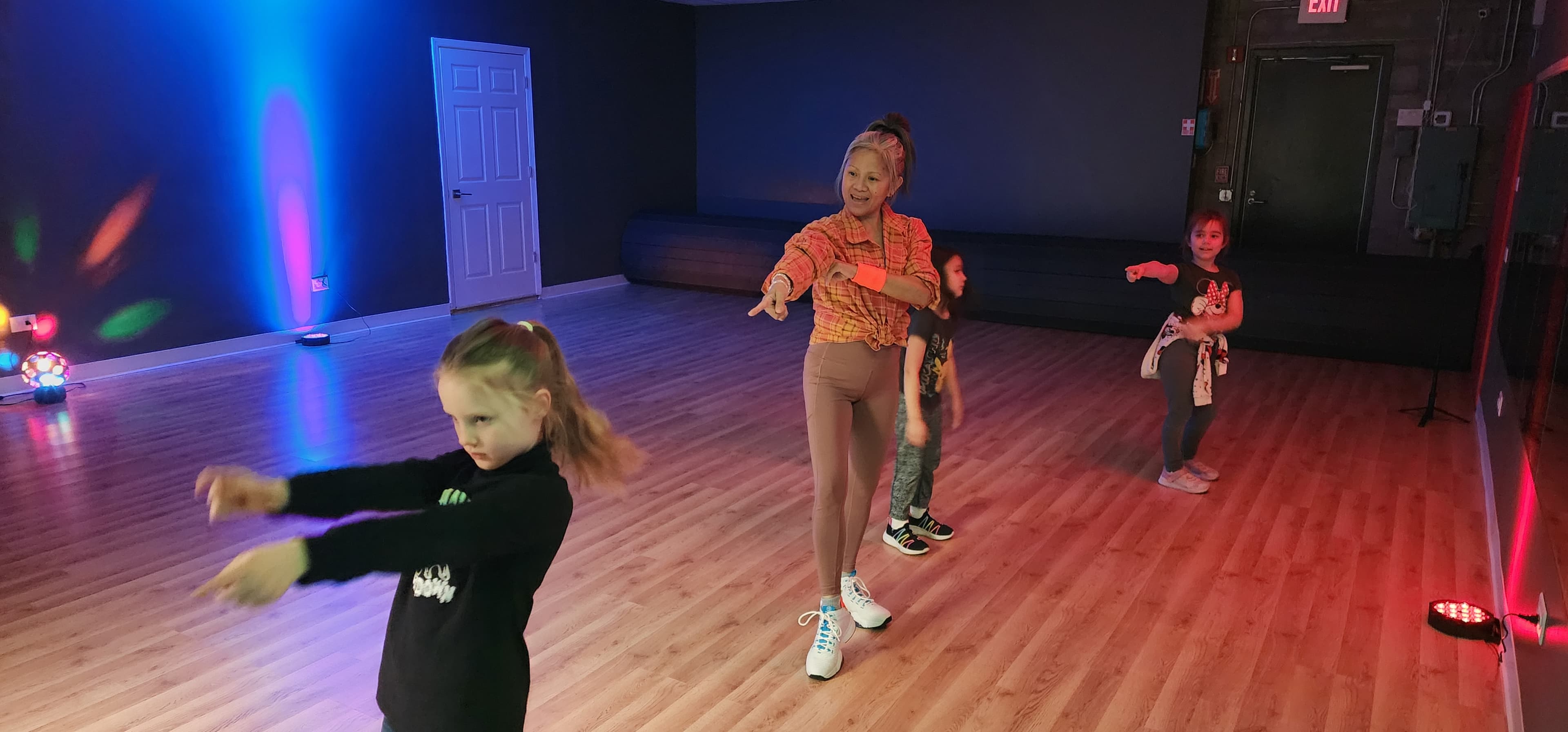 Children dancing together in the indoor movement room