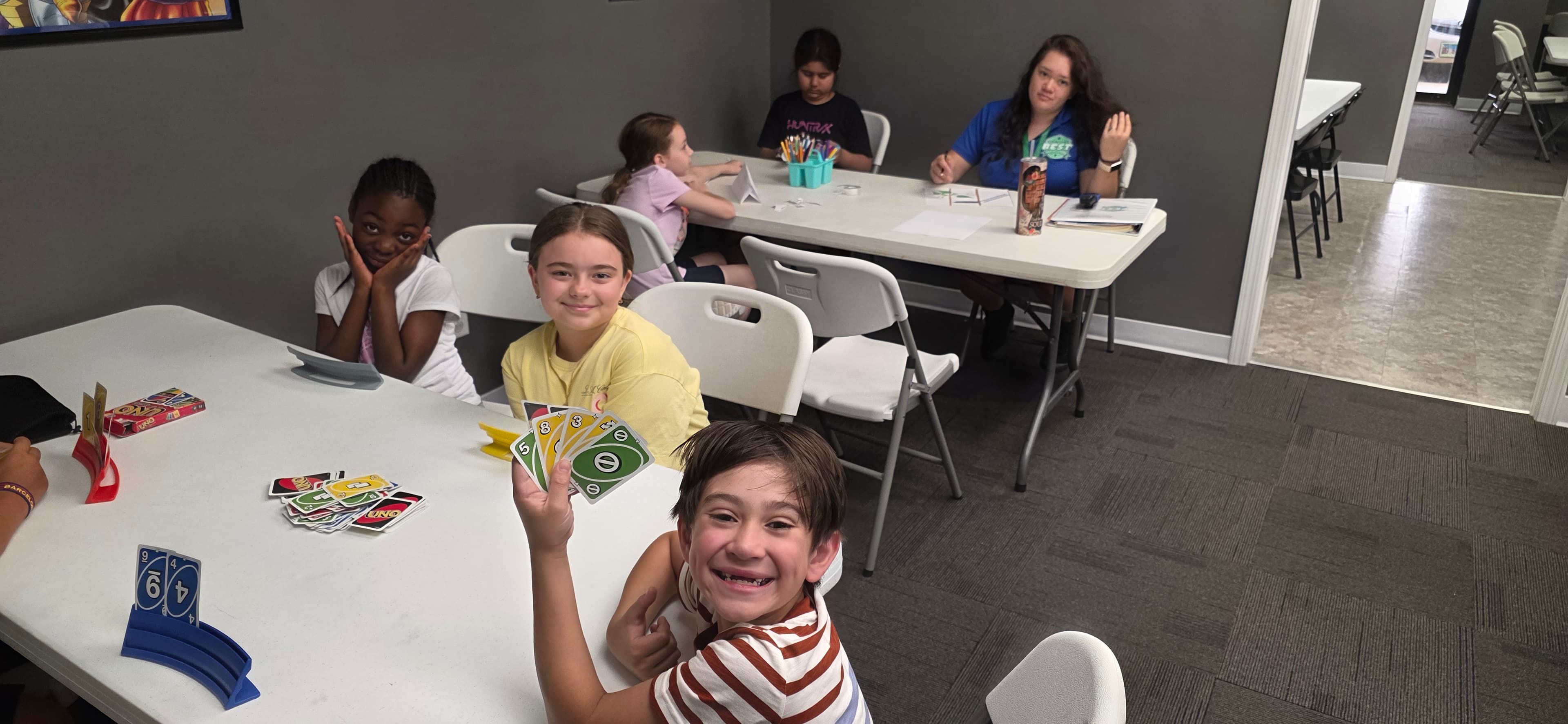Children sharing a group activity with a Plainfield's Best instructor